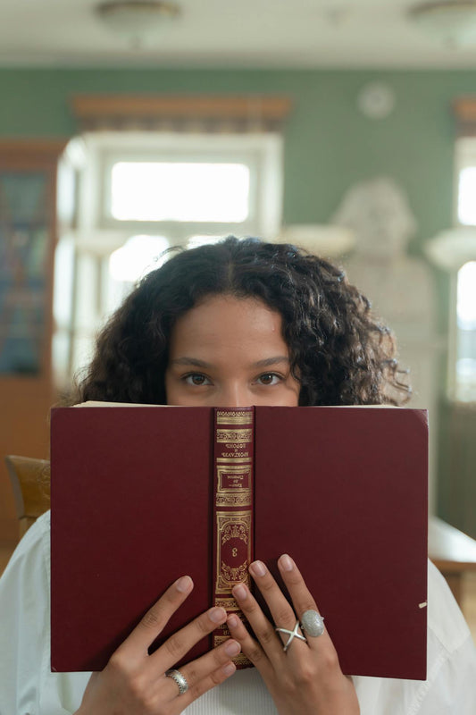 girl holding ornate book